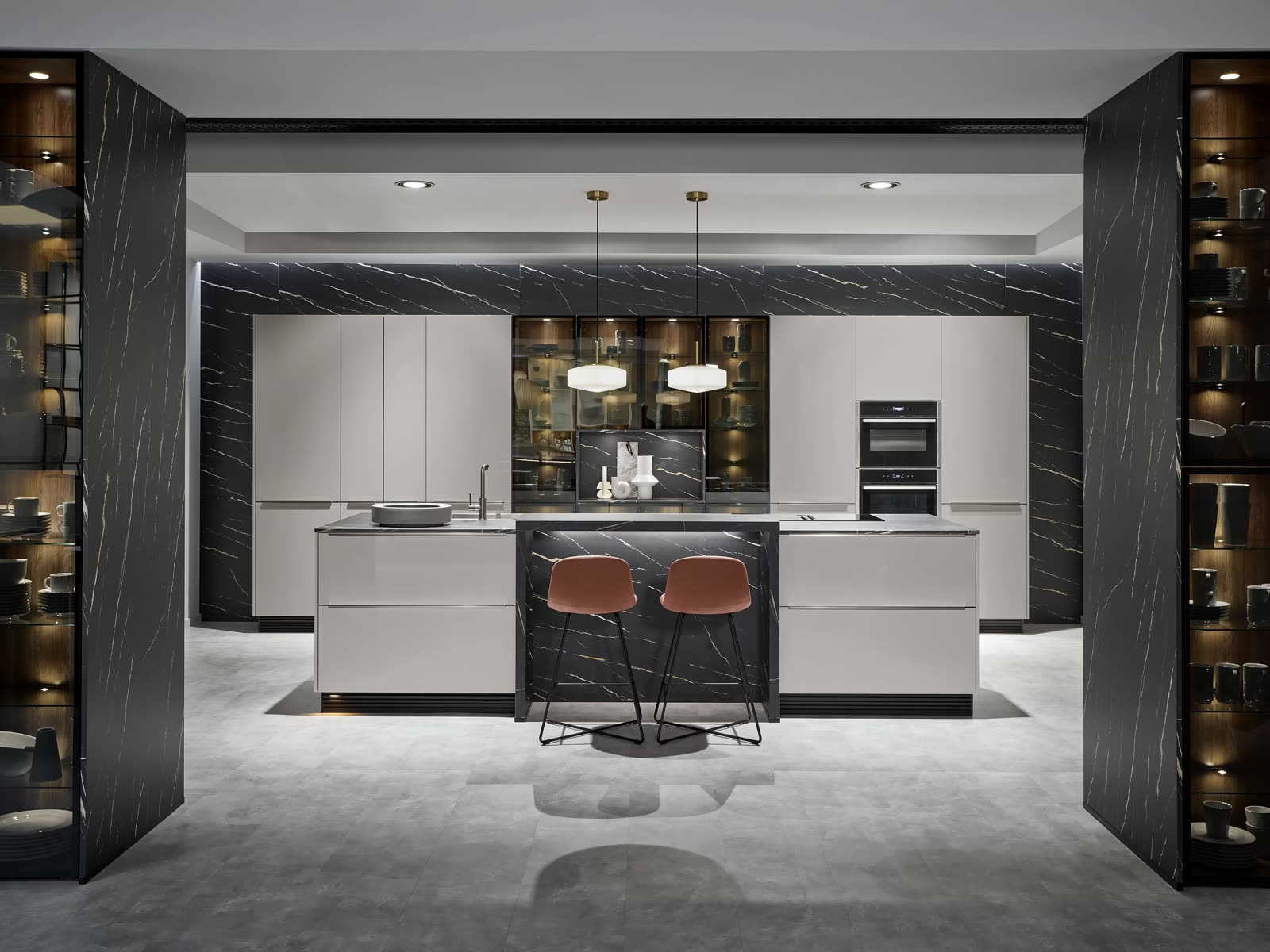 Nobilia showroom kitchen, matte black island with marble backdrop